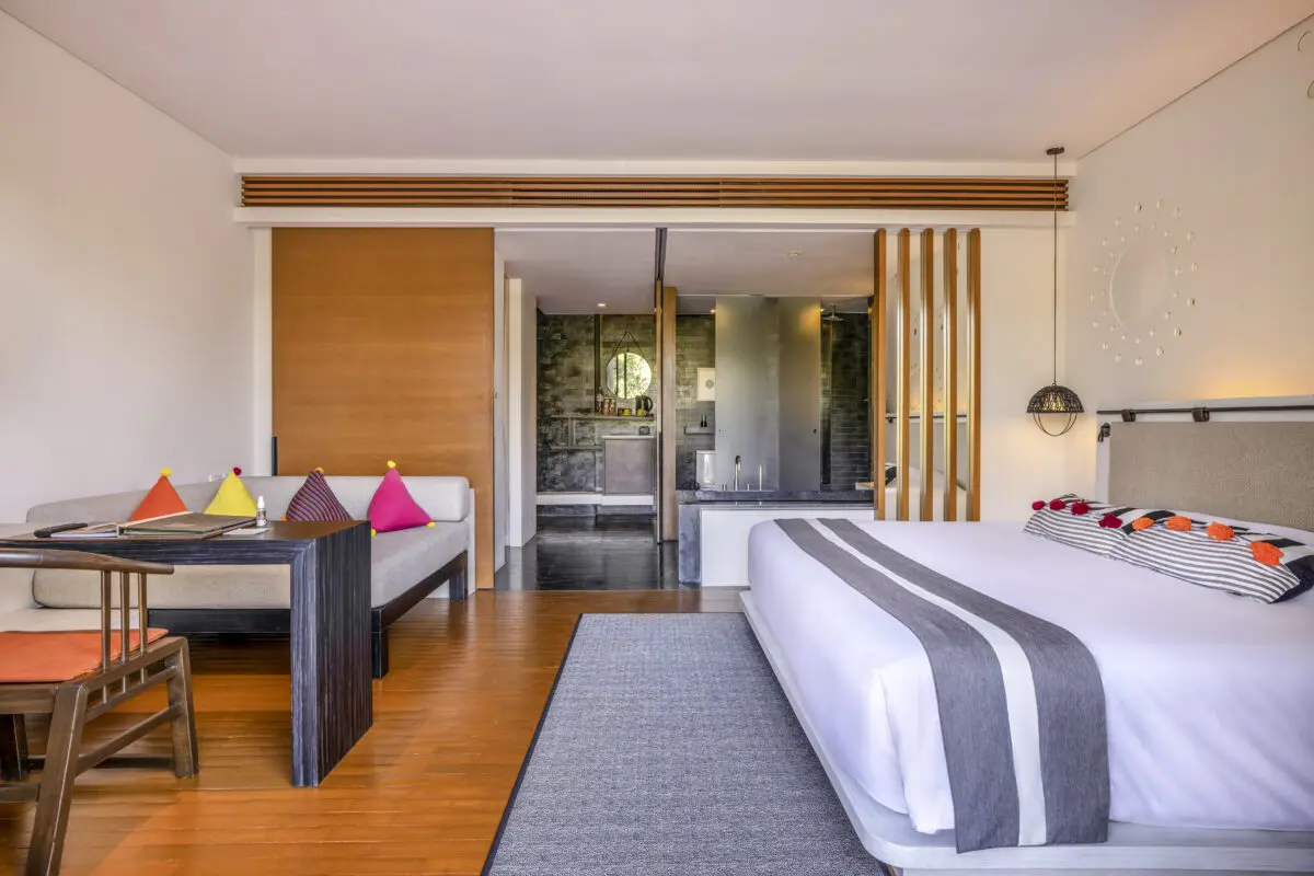 Inviting Valley Deluxe layout with large windows framing the tranquil valley surroundings of Chiang Mai.