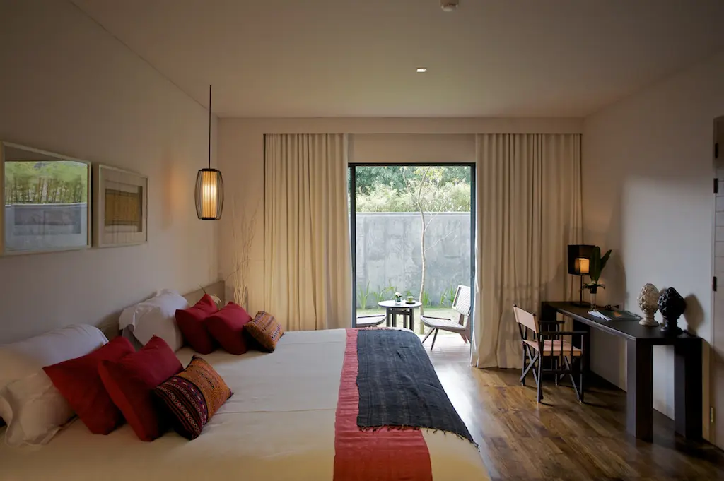 Contemporary suite entrance featuring boutique 5-star décor and warm wooden accents.