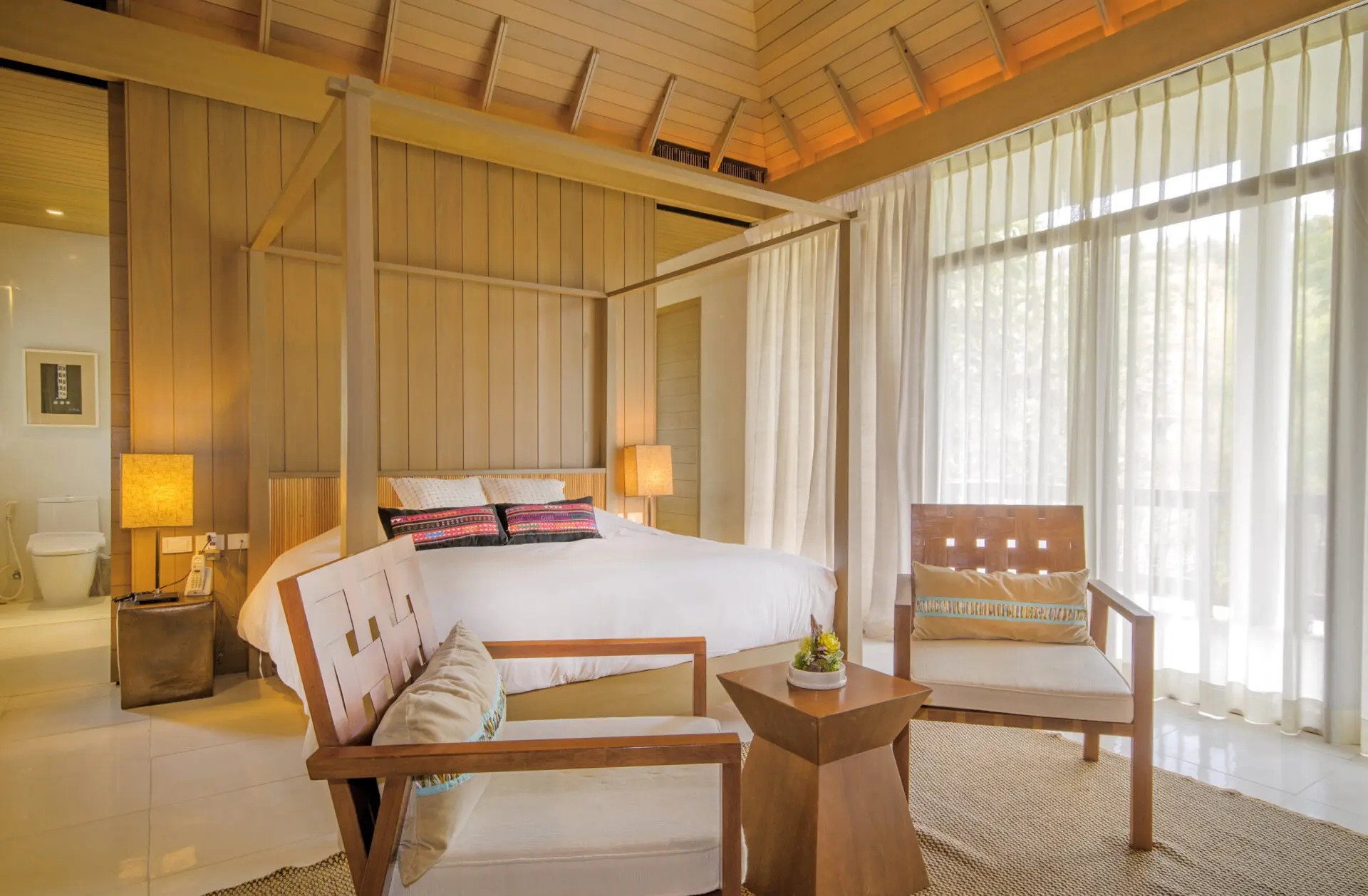 Cozy indoor seating area with refined design and a tranquil Chiang Mai ambience.