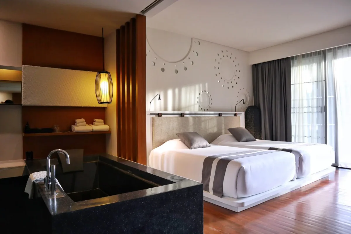 Cozy seating corner in the Valley Deluxe room overlooking the green valley landscape.
