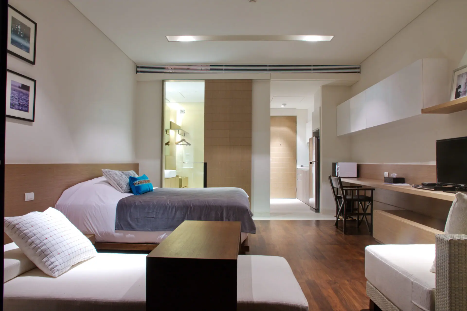Bright Comfy Studio interior featuring soft natural light and a serene hillside backdrop.