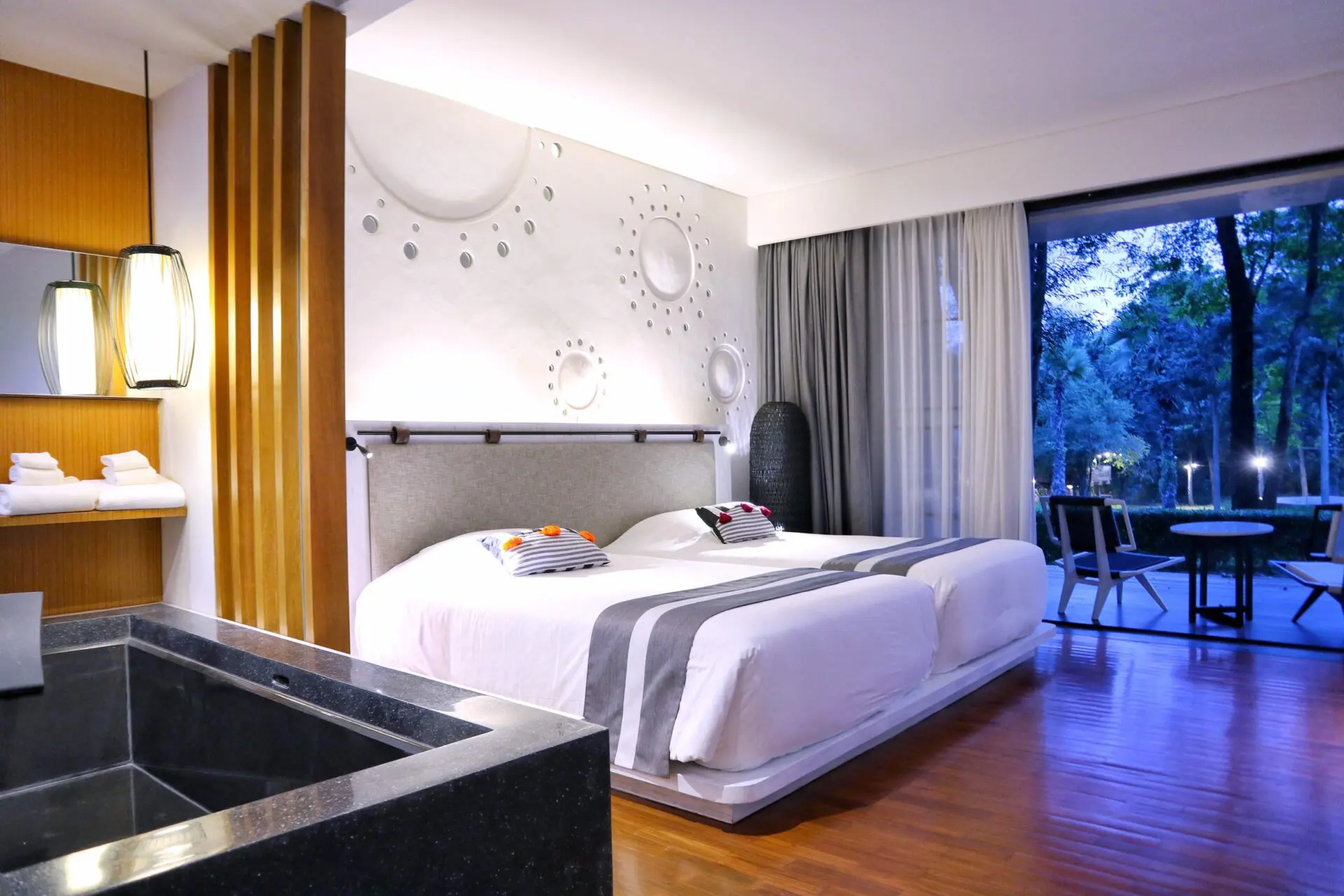 Bright and spacious Valley Deluxe Scenery interior featuring soft tones and stunning Chiang Mai hillside scenery.