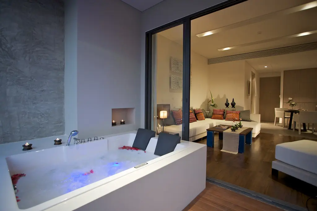 Modern suite layout blending warm tones and luxury furnishings in a peaceful mountain setting.