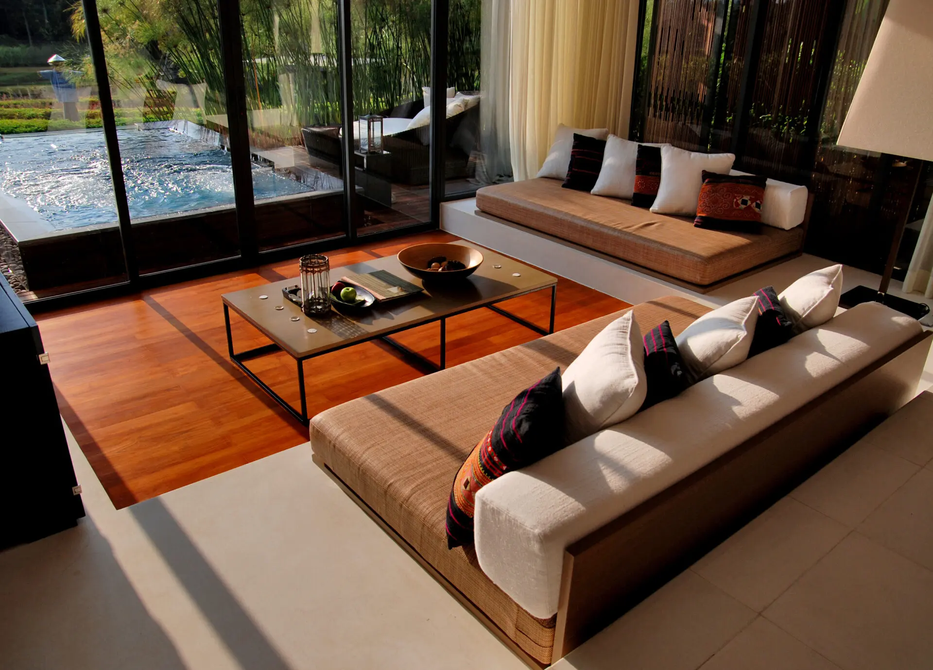 Elegant pavilion interior featuring warm natural tones and tranquil mountain scenery.