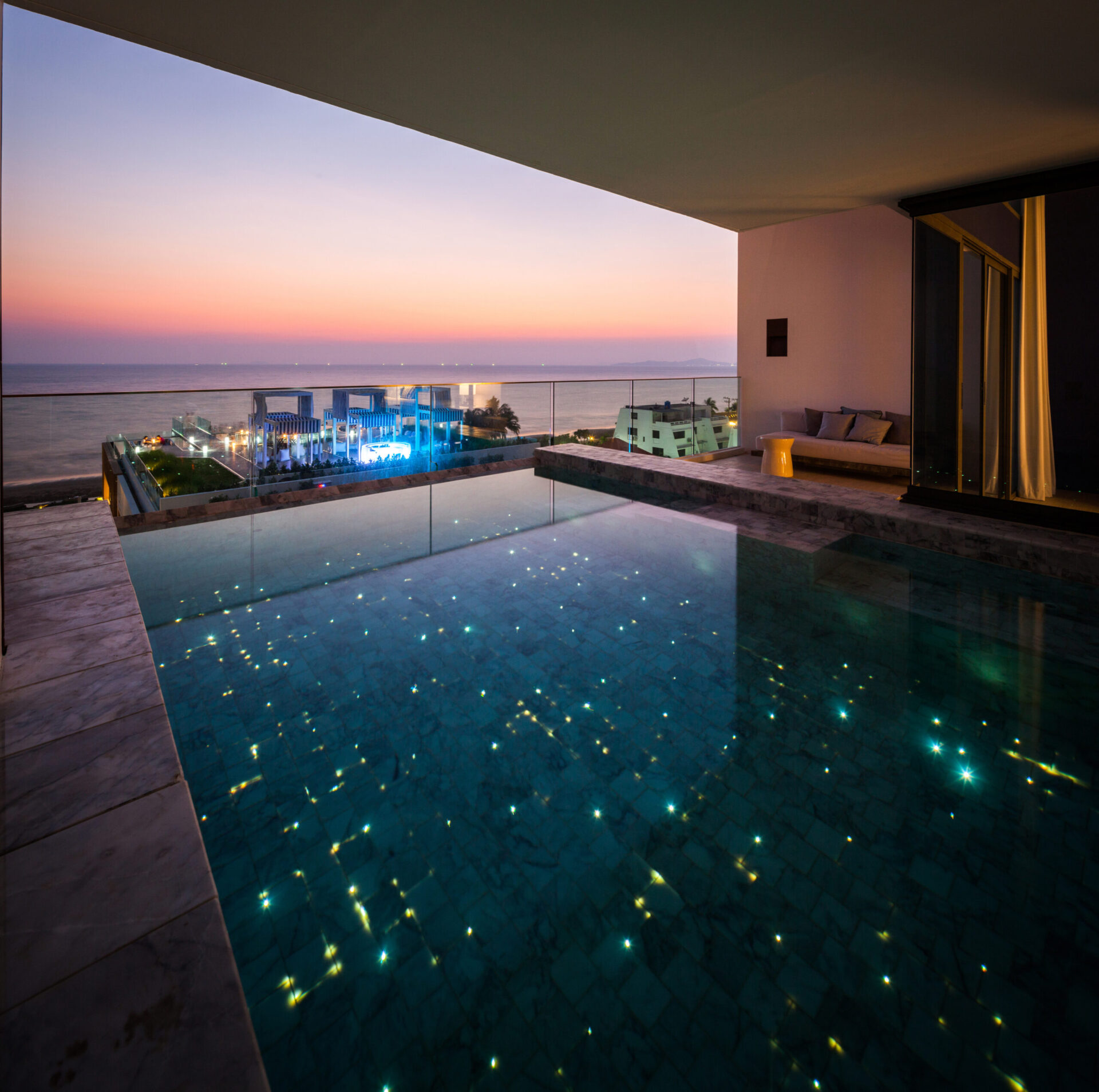 Open-concept living space blending modern design and sweeping ocean views from the villa’s upper floor.