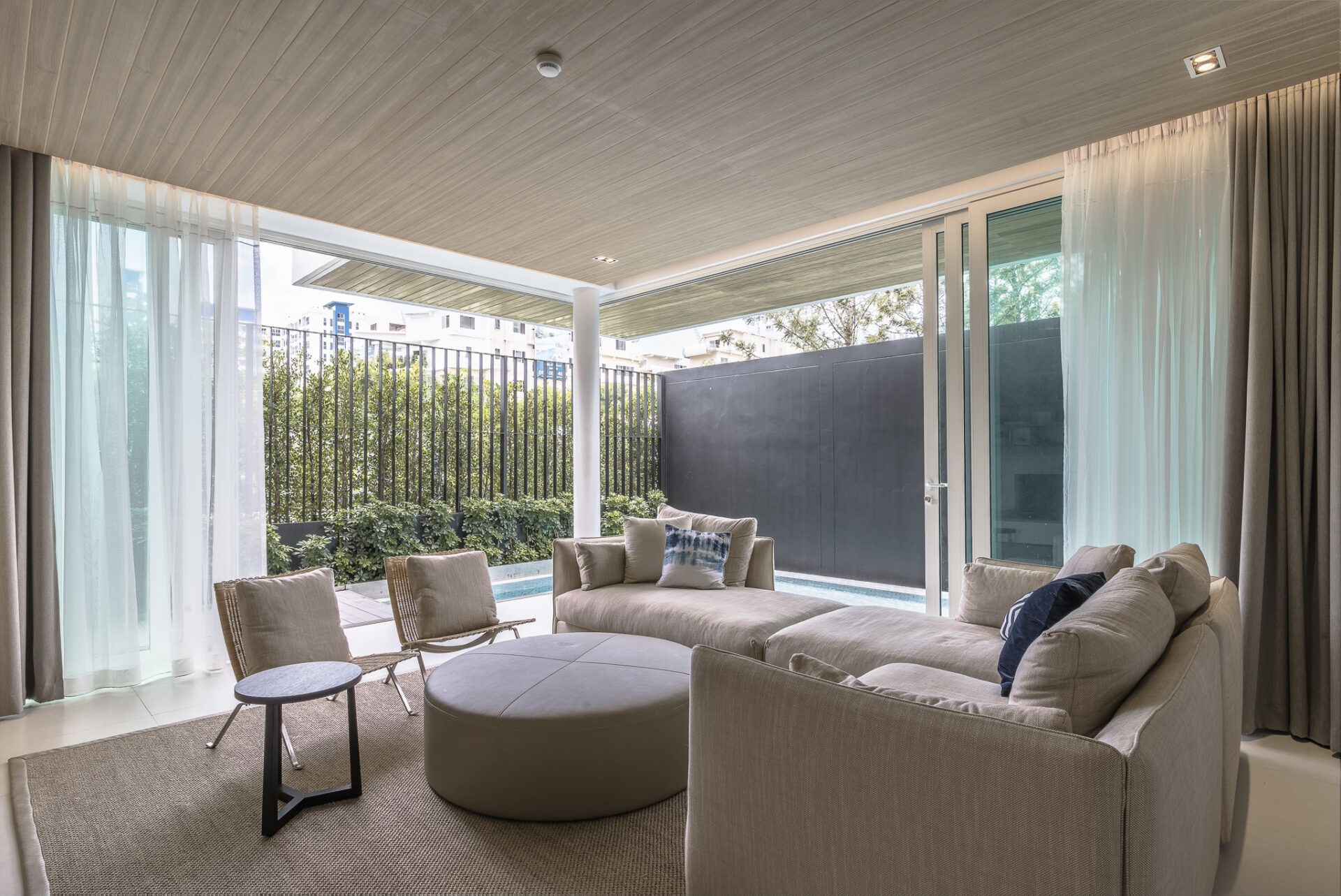 Private outdoor pool surrounded by greenery, offering a refreshing and peaceful villa experience.
