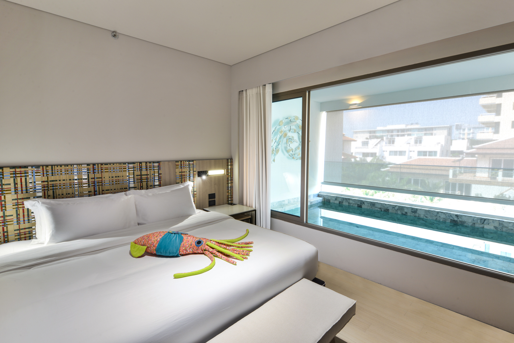 Family-friendly pool suite with warm tones and a serene private pool area ideal for small groups.