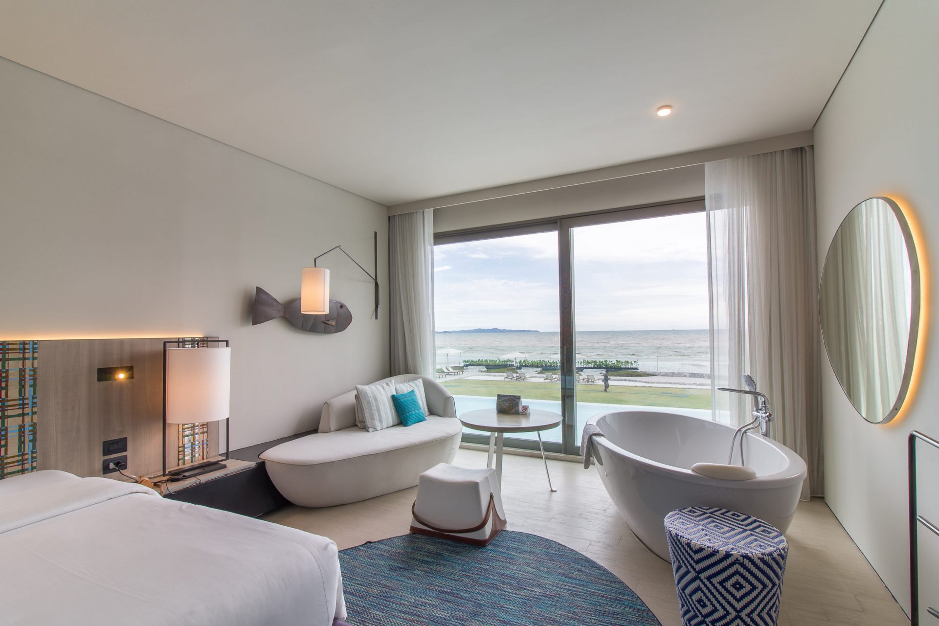 Spacious Ocean Front room featuring elegant styling and a full panoramic sea view, perfect for a relaxing beachfront escape.