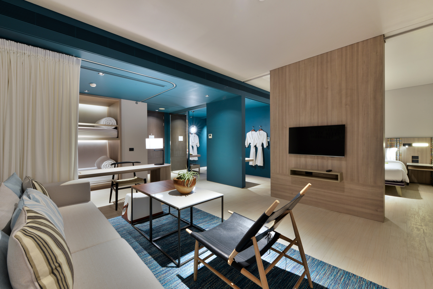 Contemporary pool suite offering a relaxing bedroom layout and direct access to a private swimming pool.