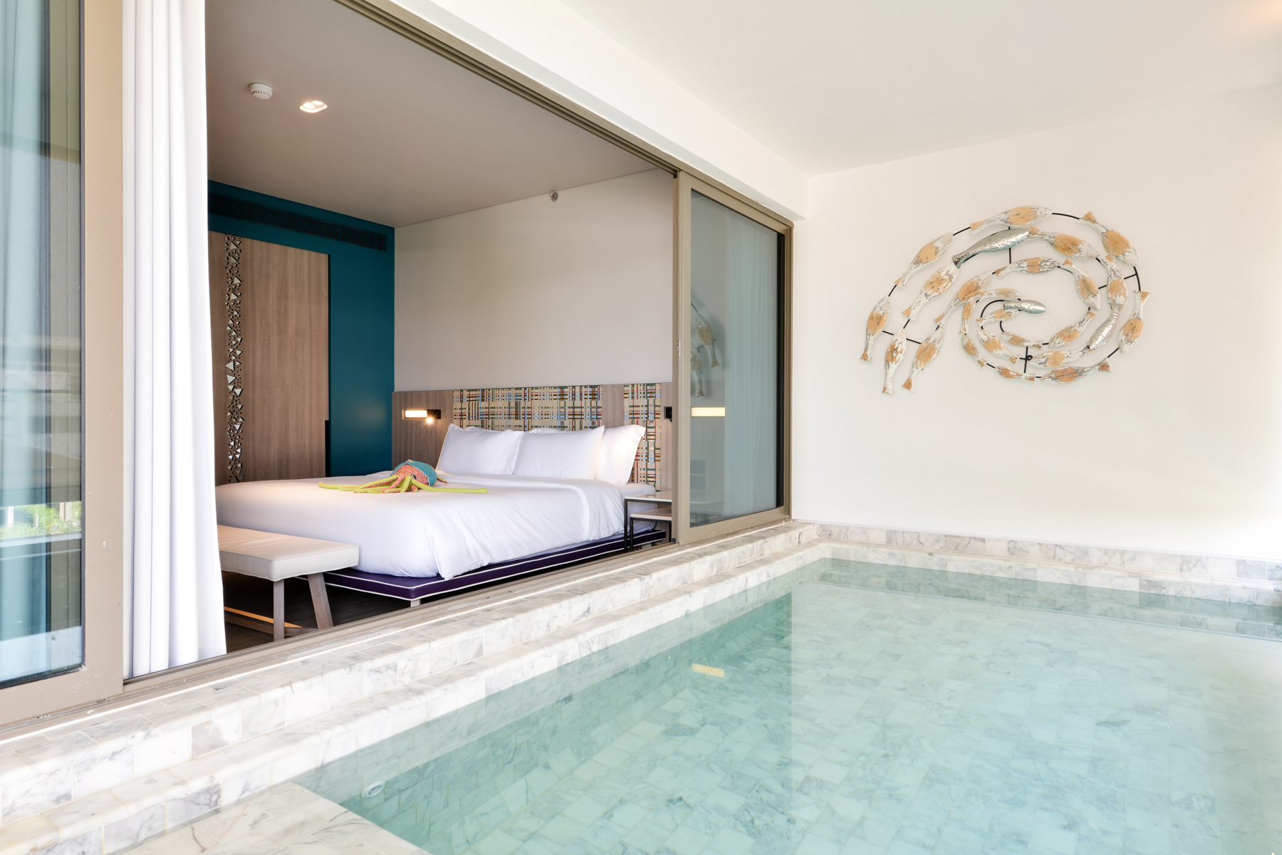 Bright and elegant pool suite with cozy living space and exclusive private pool, perfect for families visiting Na Jomtien.