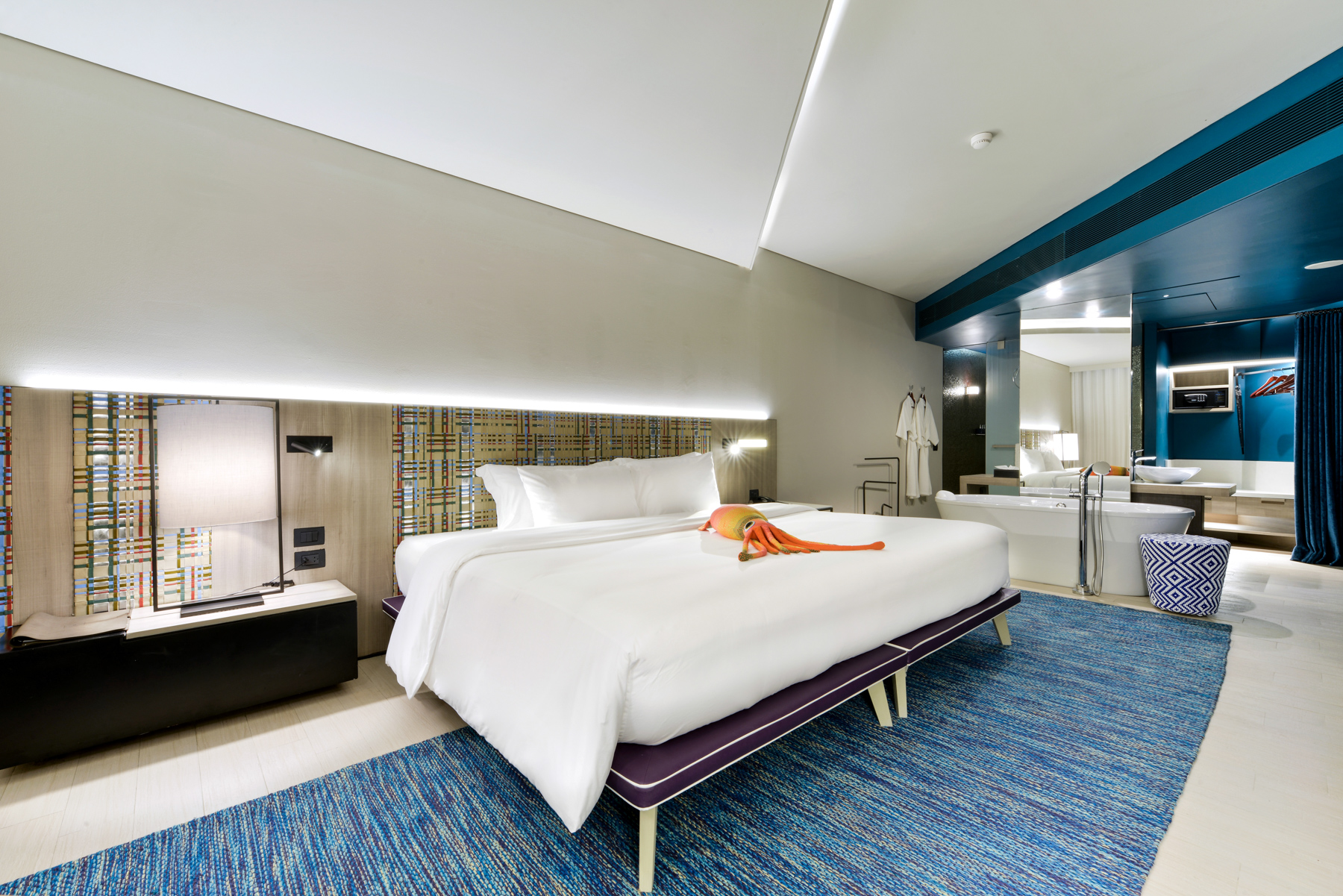 Bright and airy Sea Breeze room featuring elegant modern styling and a soothing seaside ambience, perfect for a peaceful beachfront stay.