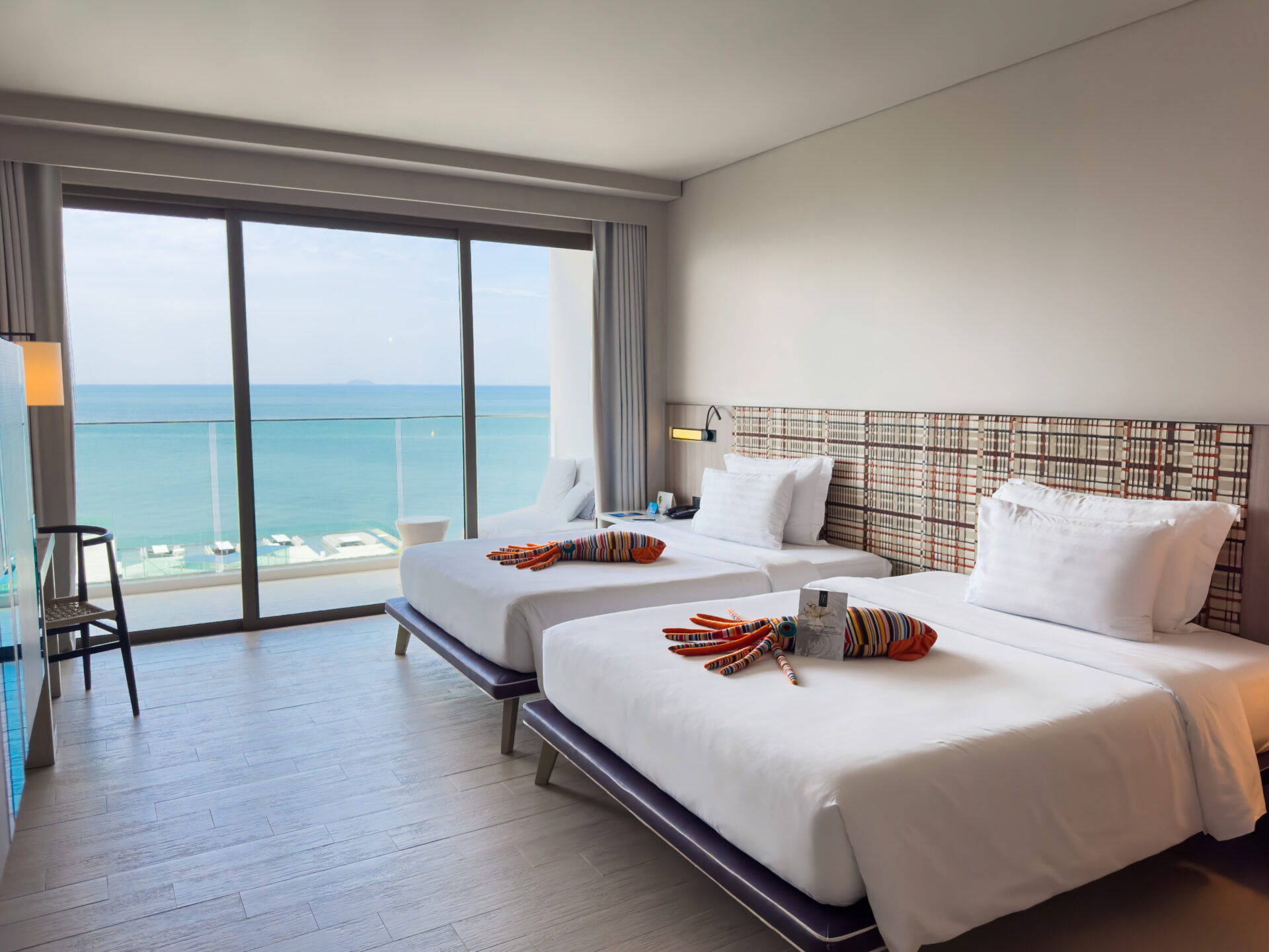 Bright and modern Seascape Ocean View room featuring calming tones and a beautiful ocean outlook, perfect for a peaceful beachfront stay.